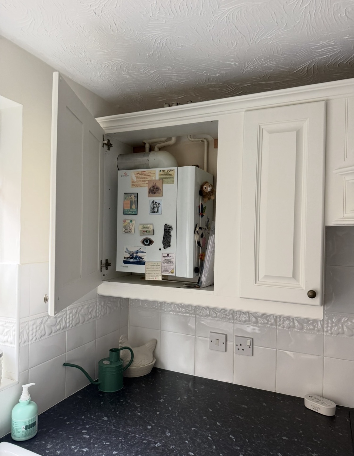 Boiler installed in kitchen cabinet